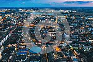 Brest, Belarus. Aerial Bird's-eye View Of Brest Cityscape Skyline. Night Bird's-eye View Of Brest Market And Pedestrian photo