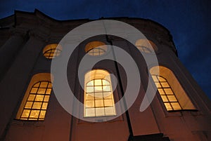 Illuminated windows of Brevnov monastery photo