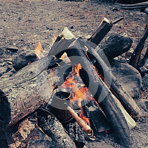 Brew coffee in a Turk on an open fire.