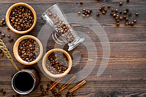 Brew coffee in turkish coffee pot. Wooden background top view copyspace