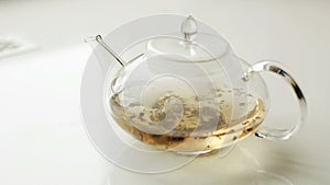 Brew tea in a glass tea pot.