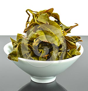 Brewed full leaf green tea in ceramic teacup