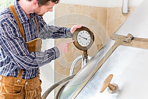 Brewer in brewhouse in beer brewery