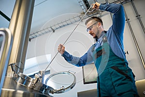 Brewer working at brewery