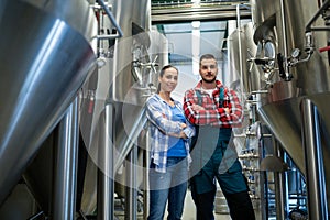 Brewers standing at brewery