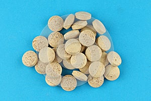Brewers yeast in tablets in a heap a lot