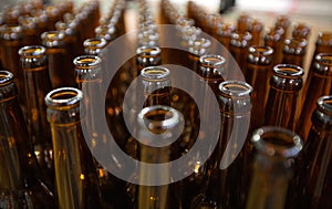 Brewery. Empty glass beer bottles, the top view