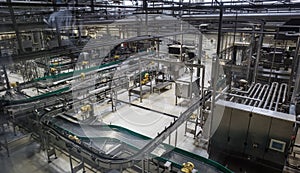 Brewery factory production line. Conveyor, pipeline and other industrial machinery, no people