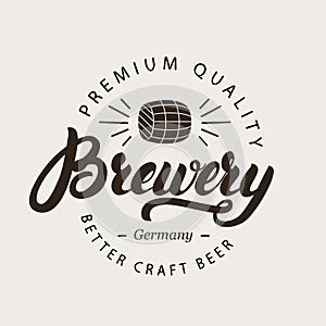 Brewery hand written calligraphy lettering logo, badge, label or emblem with barrel of beer.