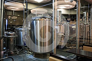 Brewery manufacturing factory. Stainless steel vats or tanks with pipes, small brewing equipment, modern alcohol production