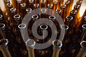 Brewery. Empty glass beer bottles, the top view