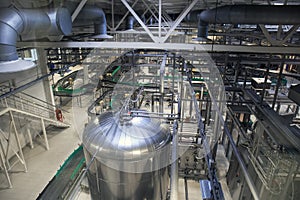 Brewery production line, steel tanks or vats for beer fermentation and manufacturing, pipelines and modern machinery