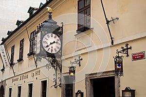 Brewery and restaurant with a clock in Prague