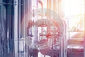 Brewery tank with beer fermentation. Interior of modern brewer manufacture. Factory equipment for beer production. Shiny