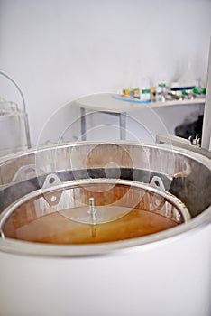 Brewery, tank or craft beer in machine for production with manufacturing process, wort and alcohol in a keg. Industrial