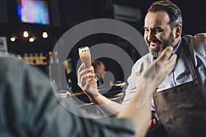 Brewery worker with glass of beer