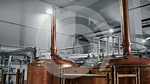 brewery workshop with mash tuns, boiling of wort in copper brew kettles