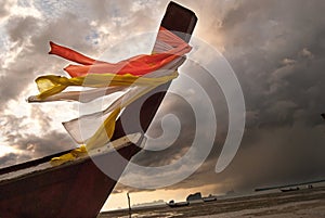 A brewing storm on an ocean sunset