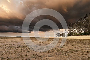 A brewing storm on an ocean sunset