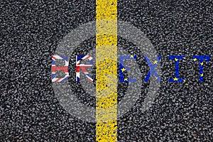 Brexit blue european union EU flag and uk great britain united kingdom flag, over tarmac, road marking yellow paint separating lin