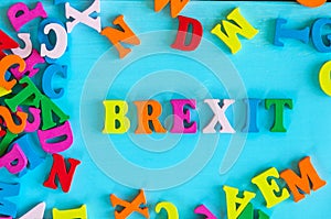 Brexit or british exit - word composed of small colored letters on blue background