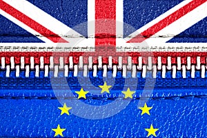 Brexit concept: European Union EU and United Kingdom UK flags connected via a closed zipper. Symbol of UK Brexit.