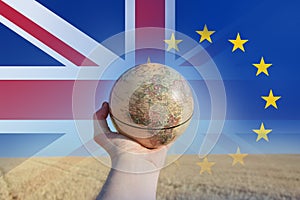 Brexit concept. A hand holding a globe showing Europe and Africa