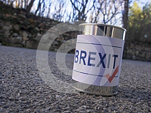 Brexit tin can in the road ready for a kick, UK EU politics metaphor or concept.