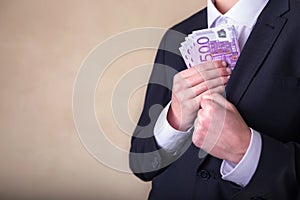 Bribe and corruption with euro banknotes.