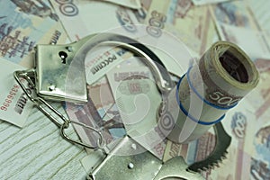 Bribe money and handcuffs violator maffia prison, photo