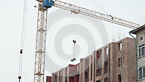 Brick apartment house building construction crane