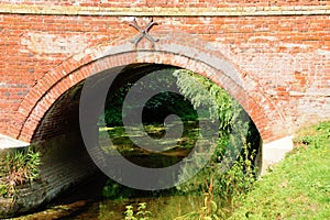 Brick arch bridge over river.