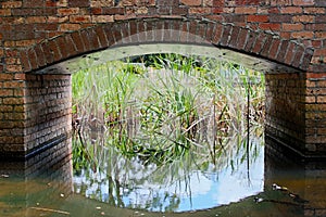 Brick arch over garden water feature