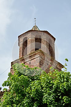 Brick belfry with a windvane