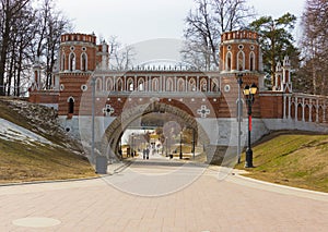 Brick bridge in the Gothic style in the park photo