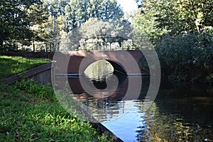 A brick bridge over a canal.