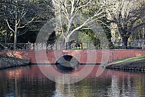 A brick bridge over a canal.