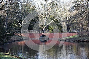 A brick bridge over a canal.