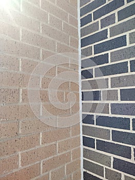 Brick building corner with unmatched bricks
