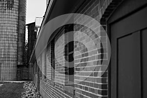 Brick building exterior in black and white