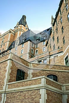 A brick building with a steeple and a large window