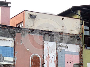 Brick building under demolition.