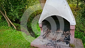 Brick-built barbecue grill with metal grill