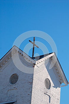 Brick built church tower with cross