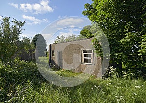 Brick built Wartime Huts lie abandoned at Stracathro Airfield and well hidden in the undergrowth.