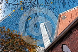 Old church building and glass office tower in Charlotte, NC