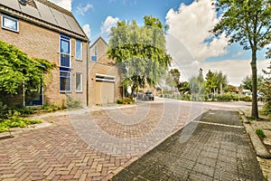 a brick driveway in front of a brick house