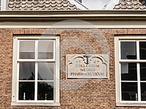 brick facade Collegium Medico Pharmaceutique 1776 in central Dutch city