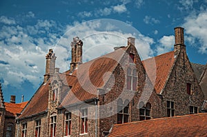 Brick facade of houses in street of Bruges