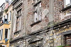 Brick facade of an old unkempt building